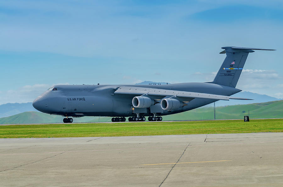 Mountain Photograph - C-5 Galaxy on runway by Javier Flores