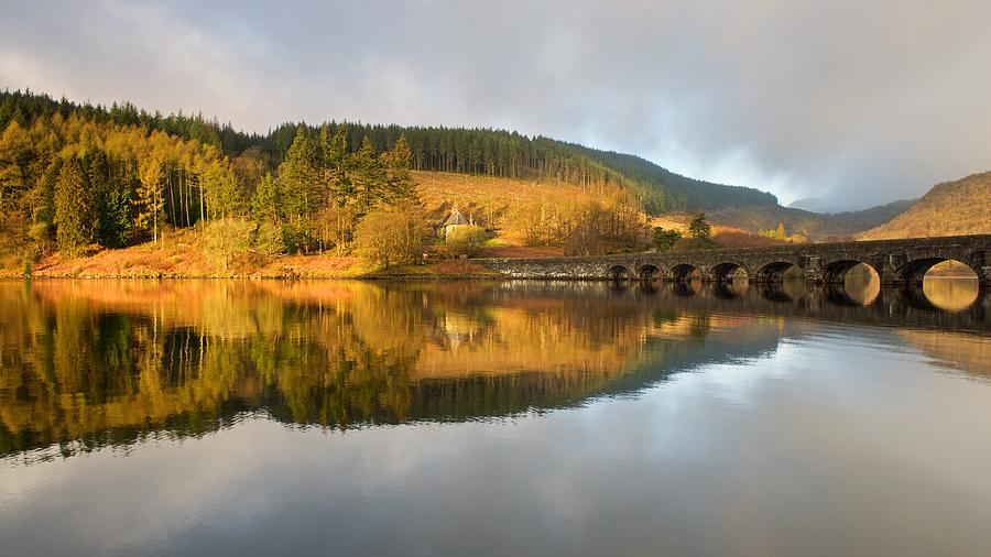 Caban Coch Reservoir reflections Photograph by Stephen Taylor