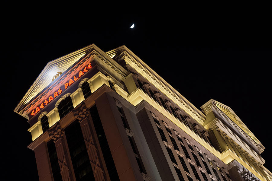 Caesars Palace with a Half Moon - Midnight in Las Vegas Photograph by Georgia Mizuleva