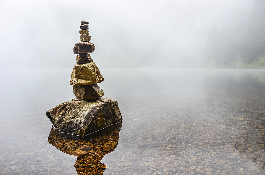Cairn in a Foggy Lake Photograph by Pelo Blanco Photo