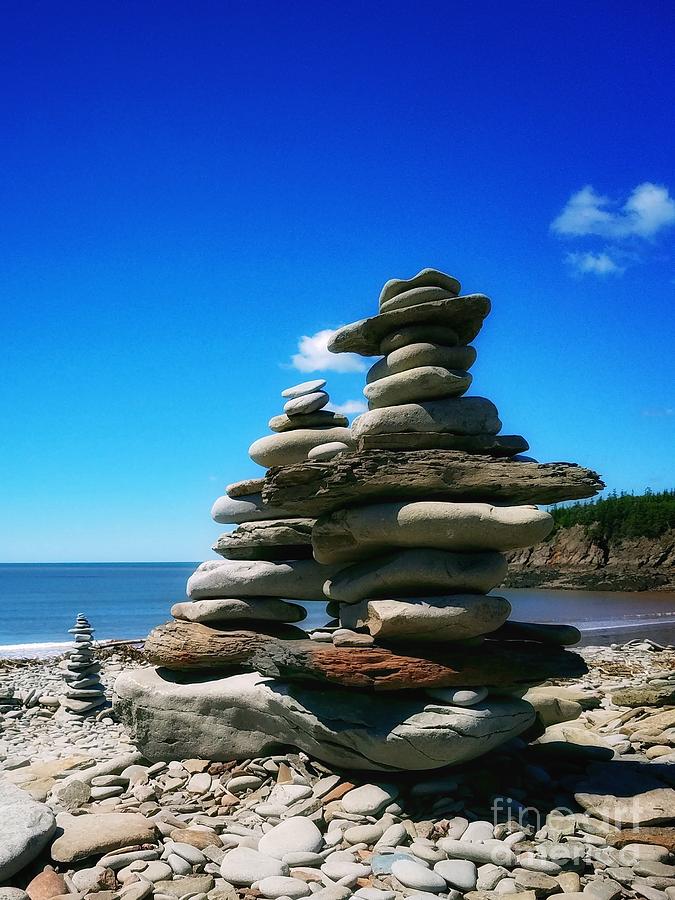 Cairns on a Rocky Beach Photograph by Mary Capriole