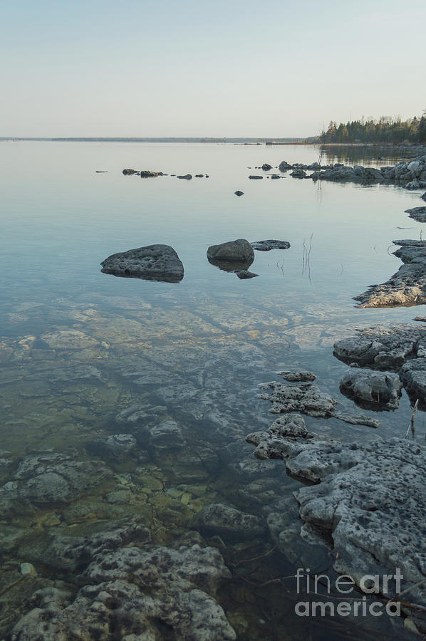 Calm clear shoreline of Lake Huron with limestone rocks Photograph by ...