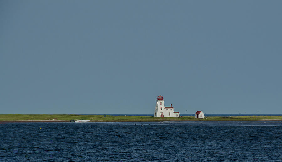 Calming Blue Sea and Sky Frame Distant Lighthouse  Photograph by Douglas Wielfaert