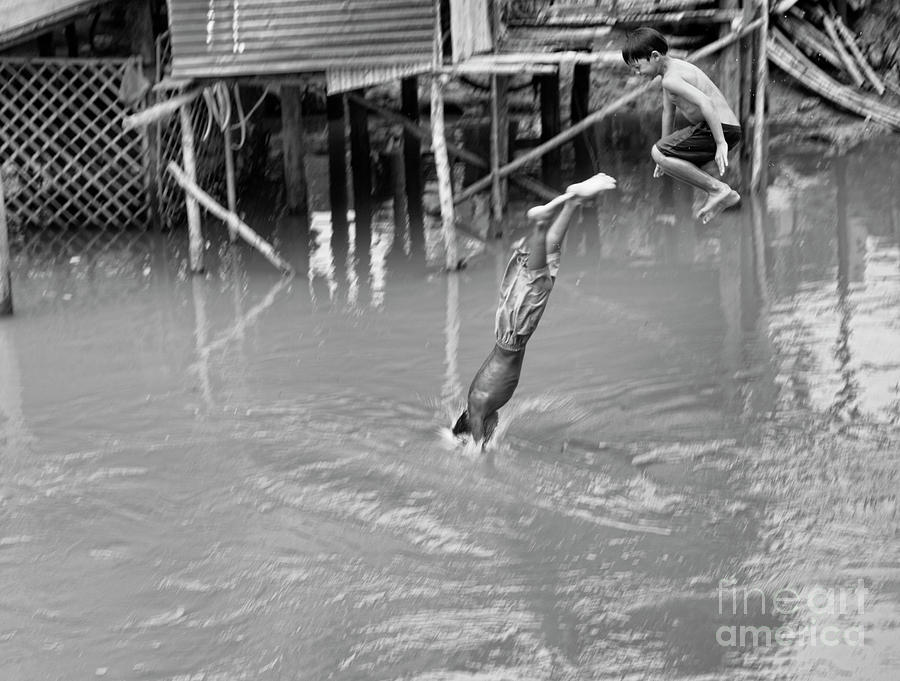 Cambodian 2 boys dive  Photograph by Chuck Kuhn