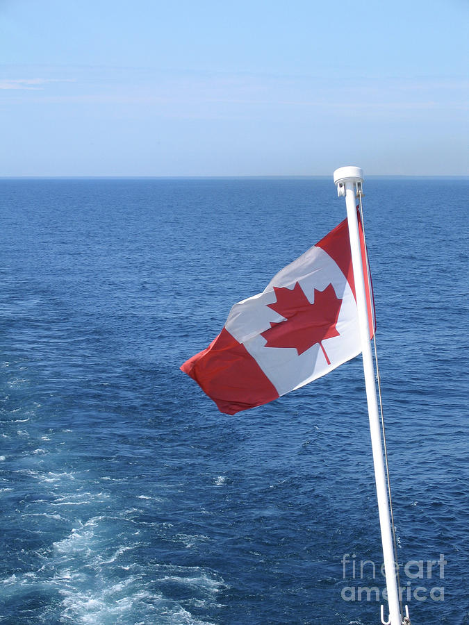 Canadian Flag Astern Photograph by Ann Horn