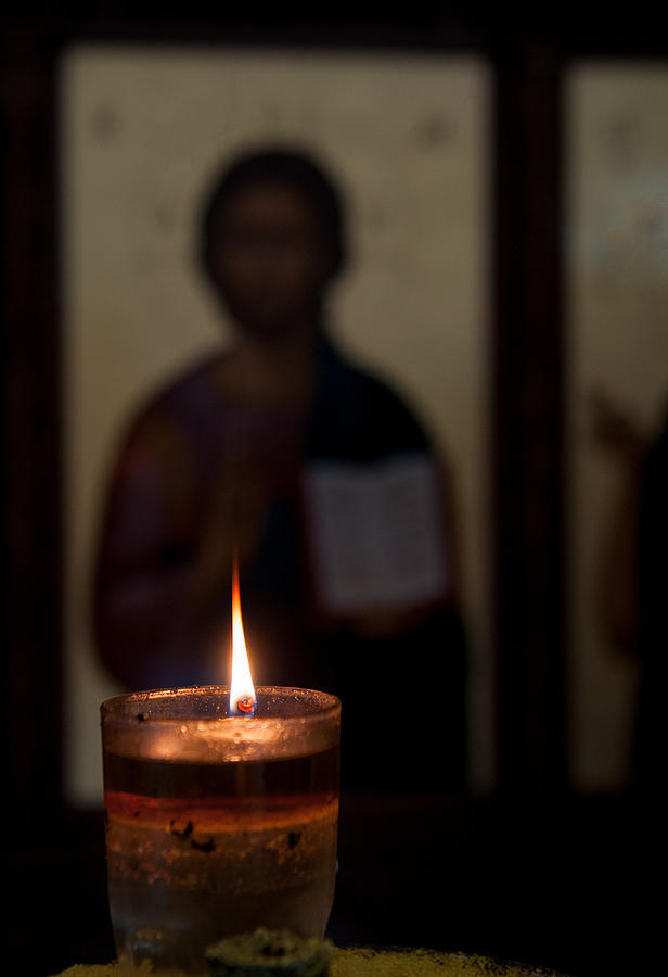 Candle light and Jesus Christ Photograph by Michalakis Ppalis