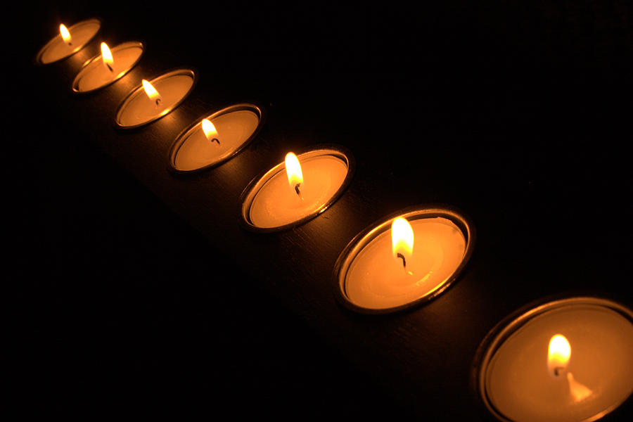 Candles in a row Photograph by Alexander Fedin
