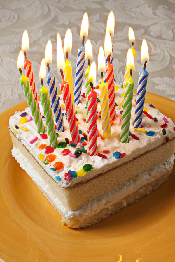 Still Life Photograph - Candles on birthday cake by Garry Gay