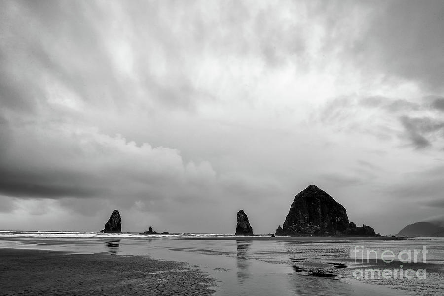 Cannon Beach in black and white Photograph by Paul Quinn