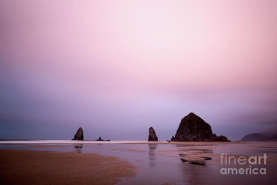 Cannon beach in the early morning blue light Photograph by Paul Quinn