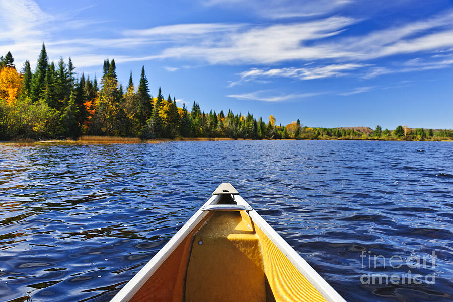Canoe bow on lake Photograph by Elena Elisseeva