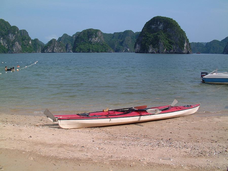 Canoe Photograph - Canoe in Halong Bay by Michael Foy