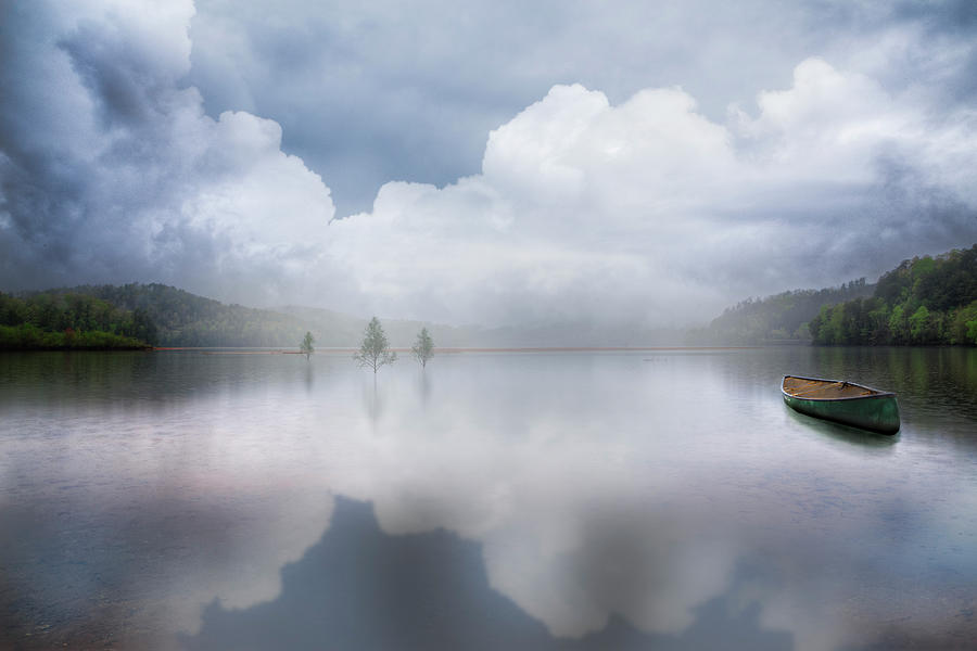 Canoe in the Clouds  Photograph by Debra and Dave Vanderlaan