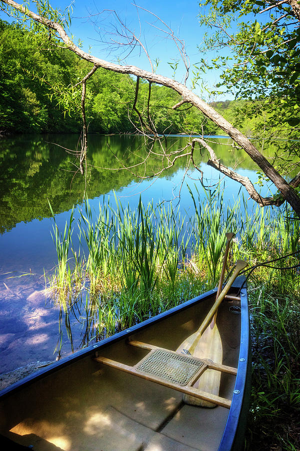 Canoe on a Mountain Lake Photograph by Debra and Dave Vanderlaan