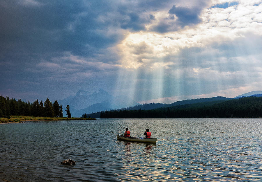 Canoeists on Maligne Lake Photograph by Dennis Kowalewski