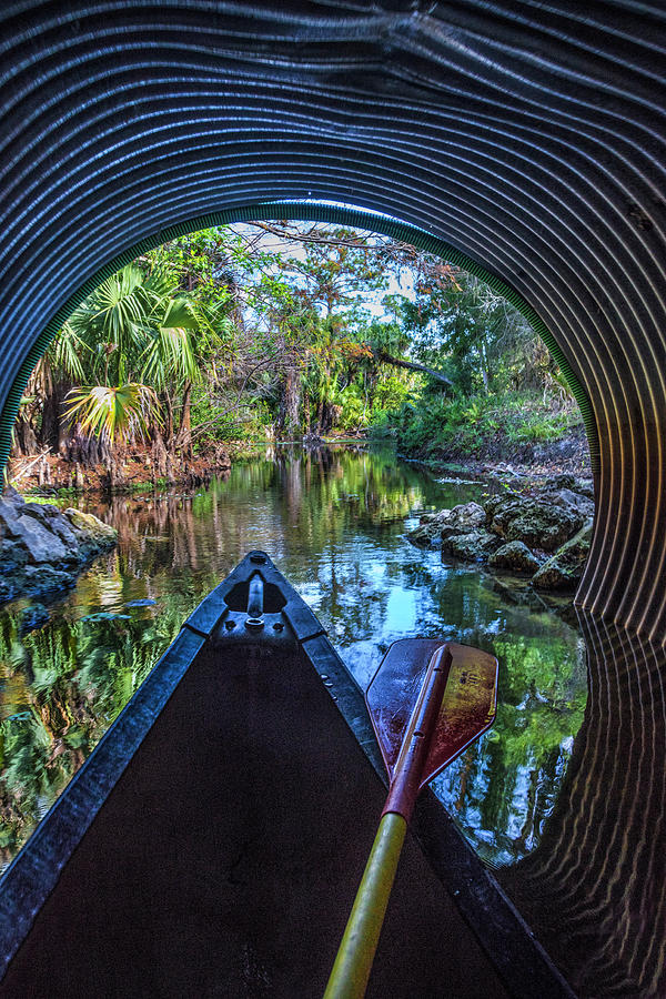 Canoeing Through the Tunnel Photograph by Debra and Dave Vanderlaan