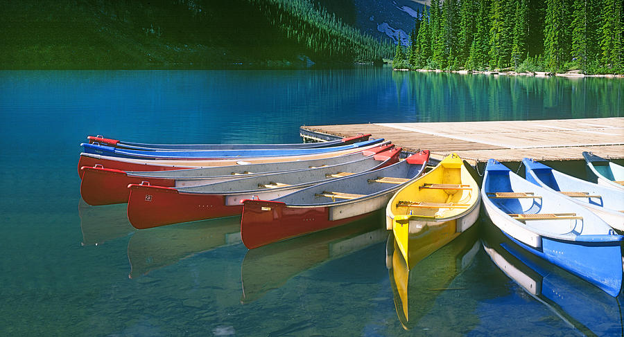 Canoes All In A Row Photograph by Buddy Mays
