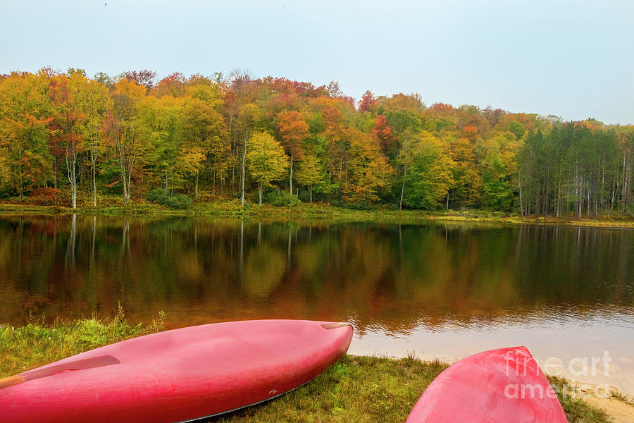 Canoes on lakes edge Photograph by Dan Friend