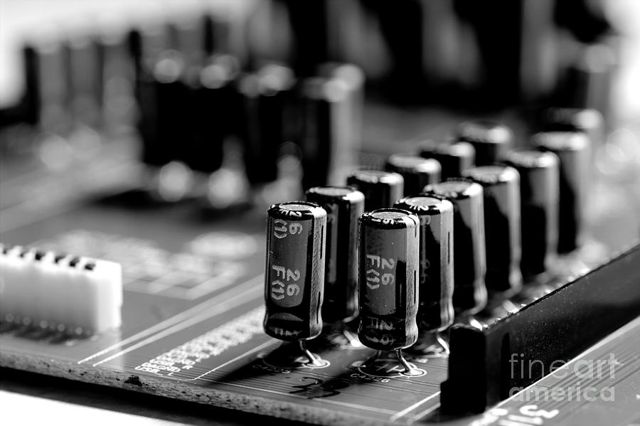 Capacitors All In A Row Photograph by Mike Eingle