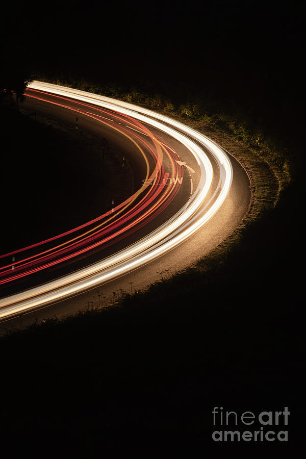 Car lights on rural road Photograph by Clayton Bastiani