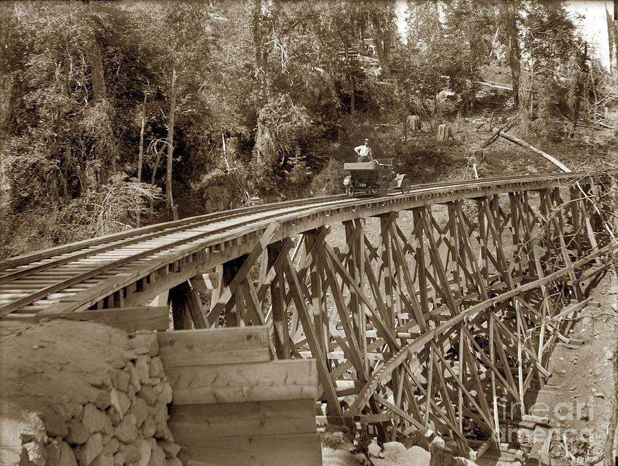 Car Photograph - Car on a wooden railroad Trestle Circa 1915 by Monterey County Historical Society