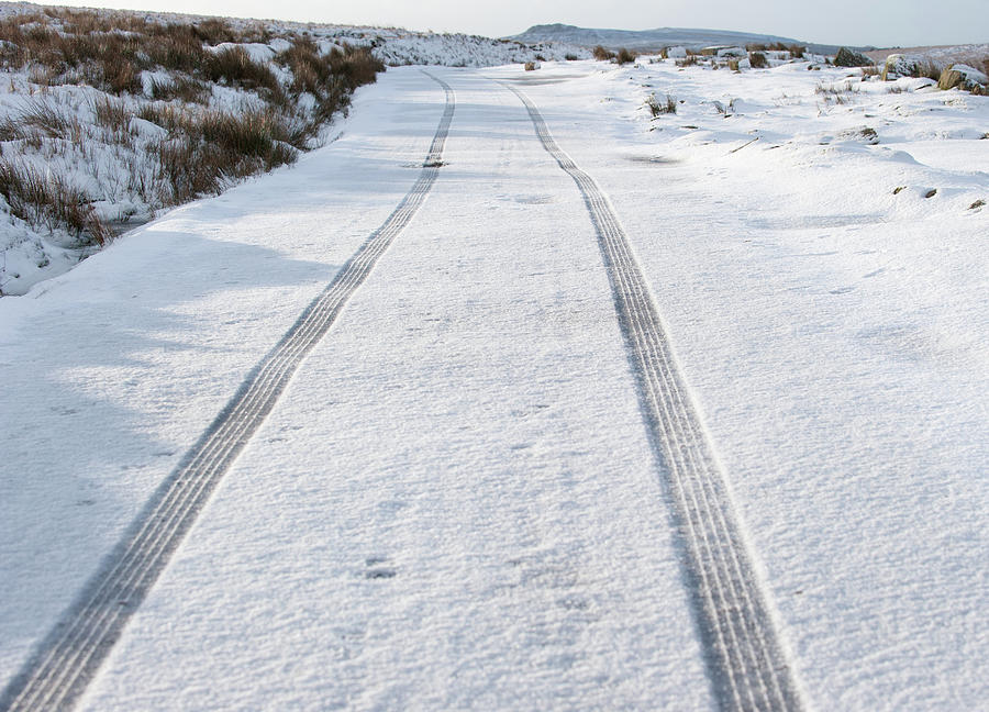 Car Tracks in the Snow Photograph by Helen Jackson