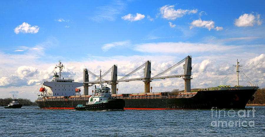 Cargo Ship and Tugboats  Photograph by Olivier Le Queinec