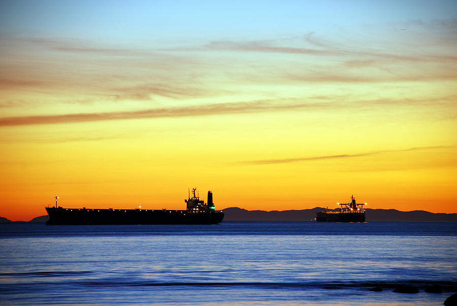 Sunset Photograph - Cargo Ships at Sunset by Alasdair Turner
