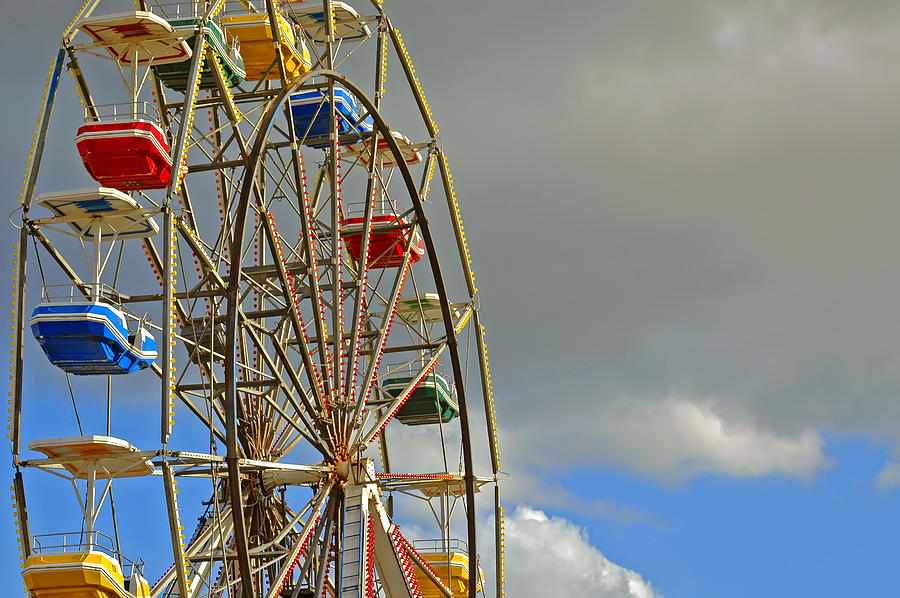 Carnival Ride on Cloudy Day Photograph by Carolyn Marshall