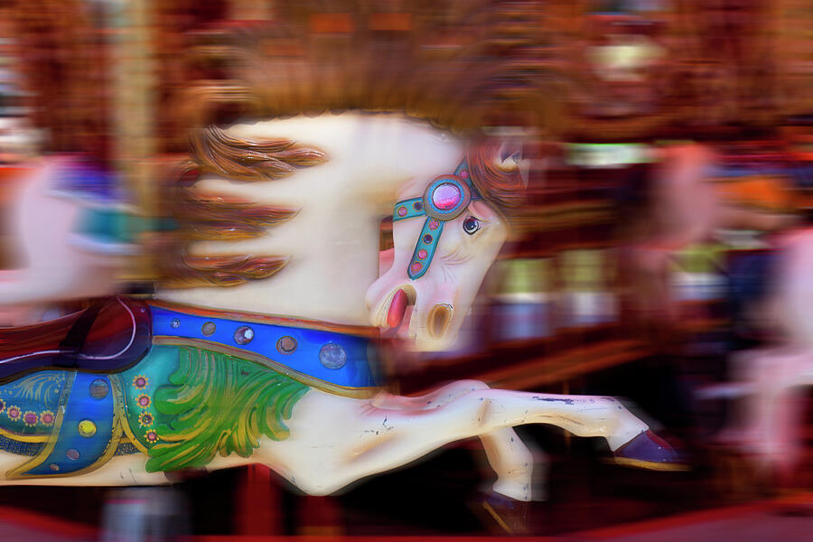 Carousel horse in motion Photograph by Garry Gay