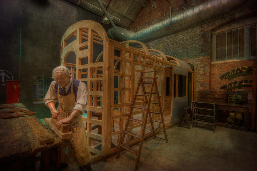 Carpenter working on Carriage Photograph by Clare Bambers
