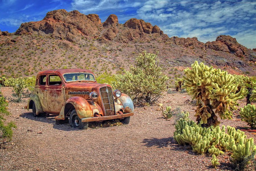 Cars And Cactus Photograph by Joan Escala-Usarralde