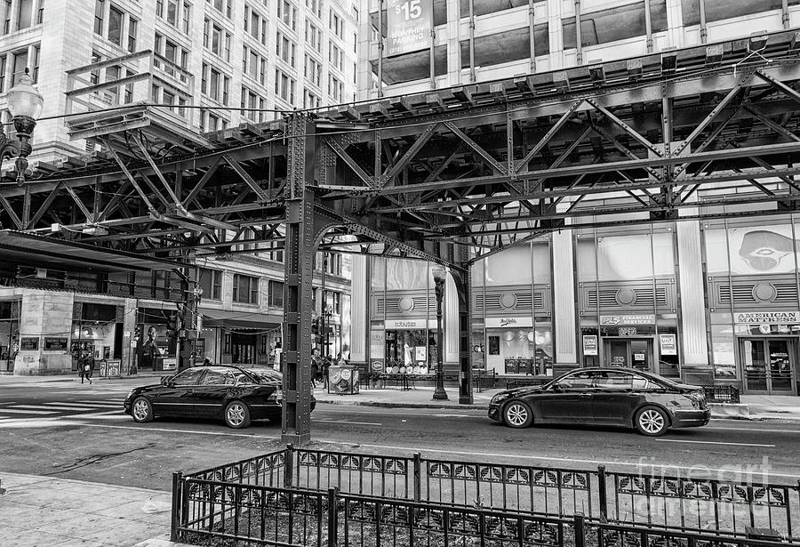 Cars driving Chicago down town under elevated train track Photograph by Patricia Hofmeester
