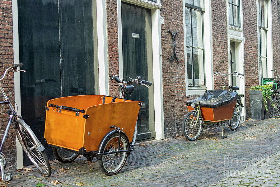 Cart bikes for transporting small children to school Photograph by Patricia Hofmeester