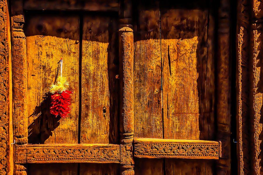 Carved Wooden Door And Peppers Photograph by Garry Gay