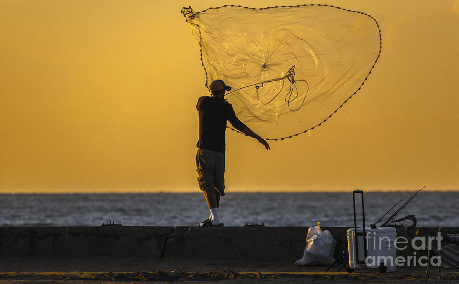 Cast Net Fisherman at Sunset by Ron Buskirk