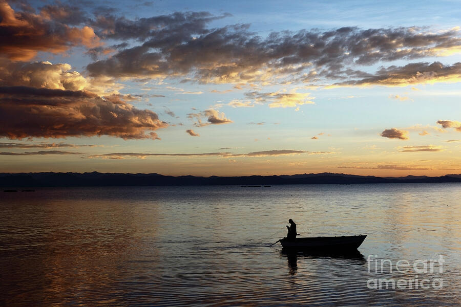 Casting the Net on Lake Titicaca Photograph by James Brunker