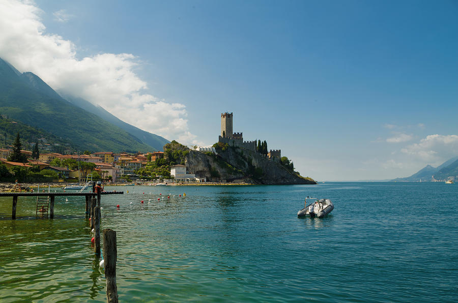Castle Photograph - Castle of Malcesine, view from the beach by Nicola Aristolao