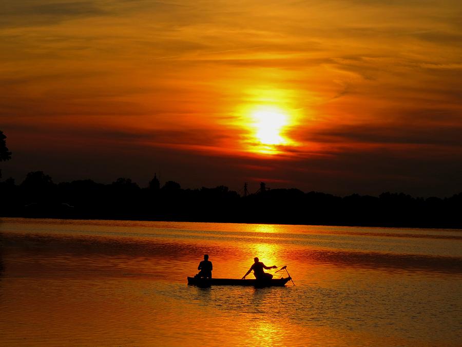 Fish Photograph - Catching Sunset by William Caine