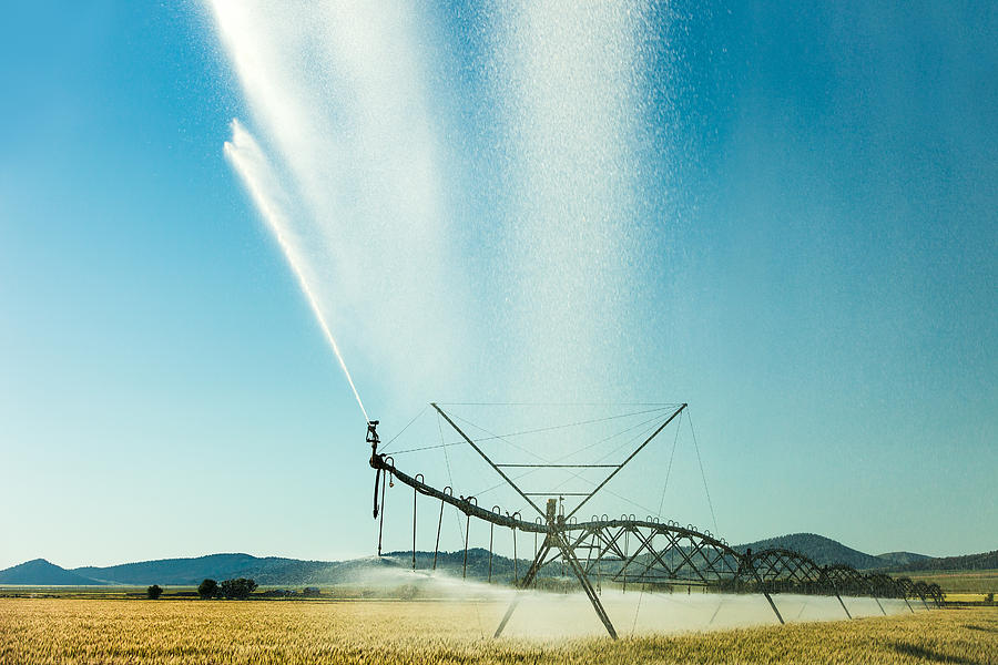 Center Pivot Irrigation Unit Spraying Water Photograph by Todd Klassy