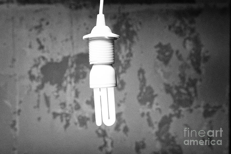 Cfl Compact Fluorescent Energy Saving Lightbulb Burning In A Derelict