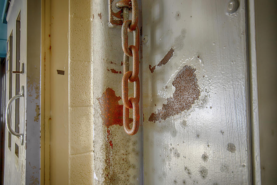 Chains on prison cell door Photograph by Karen Foley