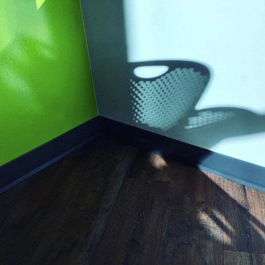 Summer Photograph - Chair Shadow. Green Wall. Tiny Triangle by Ginger Oppenheimer