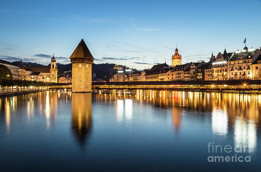 Chapel bridge in Lucerne at night, Switzerland.  Photograph by Didier Marti