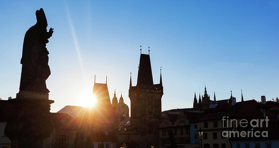 Charles Bridge at sunrise, Prague, Czech Republic. Statues and towers silhouettes Photograph by Michal Bednarek