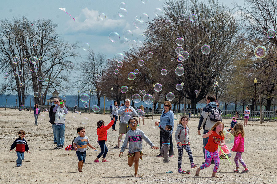Chasing Bubbles Photograph by Mary Courtney