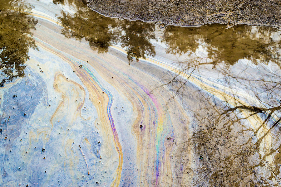 Chemical Oil Spill on Water Photograph by John Williams