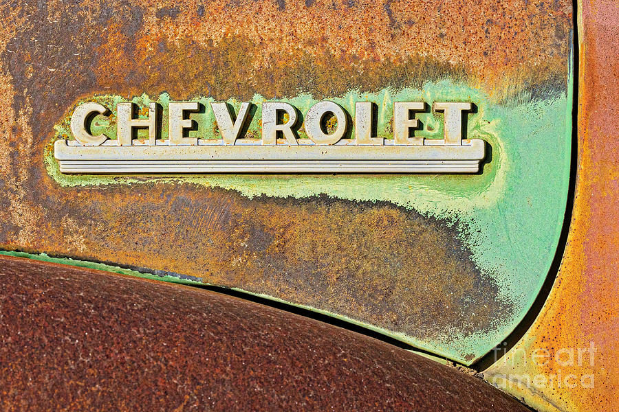 Chevrolet Logo and Rust Photograph by Jerry Fornarotto
