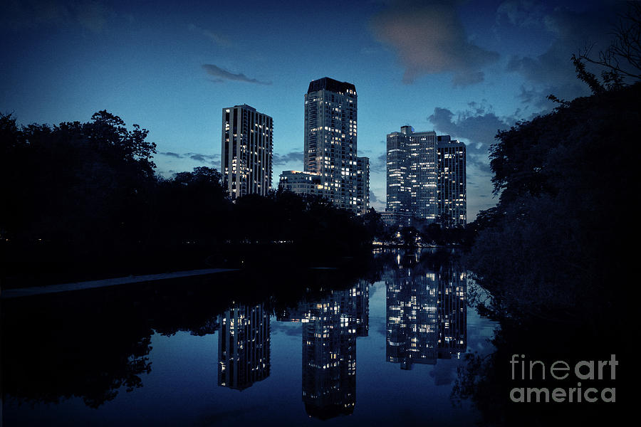 Sunset Photograph - Chicago high-rise buildings by the Lincoln Park Pond at night by Bruno Passigatti