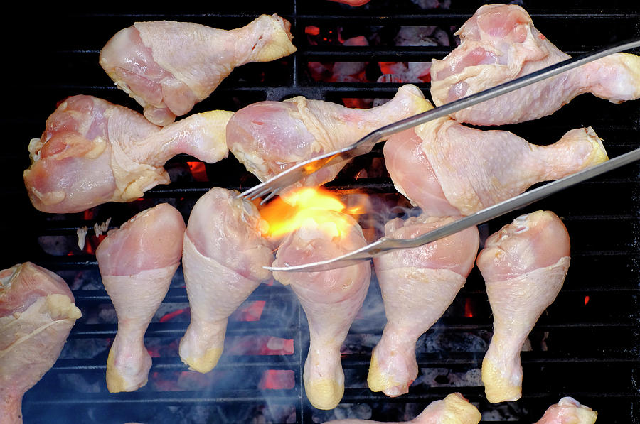 Chicken legs on a barbecue Photograph by Fabrizio Troiani